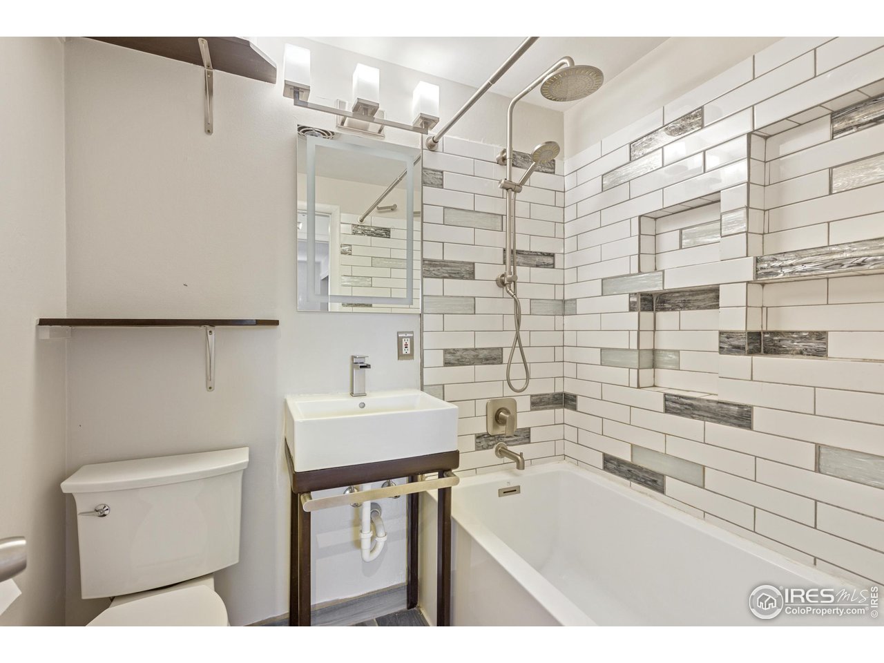 725 South 45th Street Boulder, CO 80305 - Photo 20 of 44 a bathroom with a sink a toilet and shower