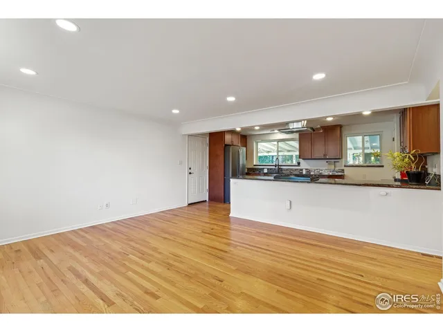 a view of kitchen with stainless steel appliances a refrigerator and a counter top space