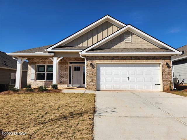 612 Britton Way, Unit 70 Macon, GA 31216 - Photo 1 of 18 a front view of a house with a garage
