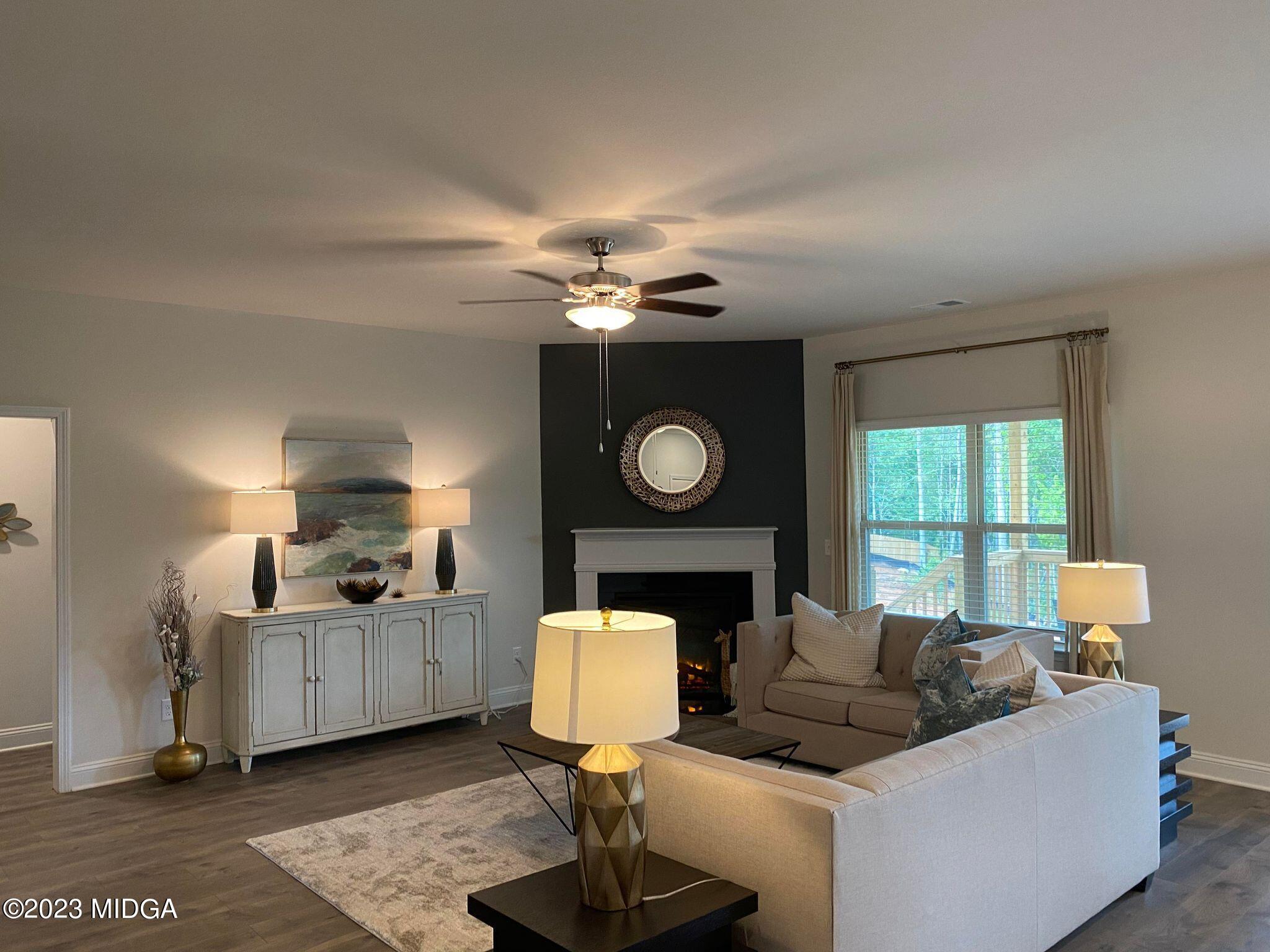 612 Britton Way, Unit 70 Macon, GA 31216 - Photo 11 of 18 a living room with furniture and a fireplace