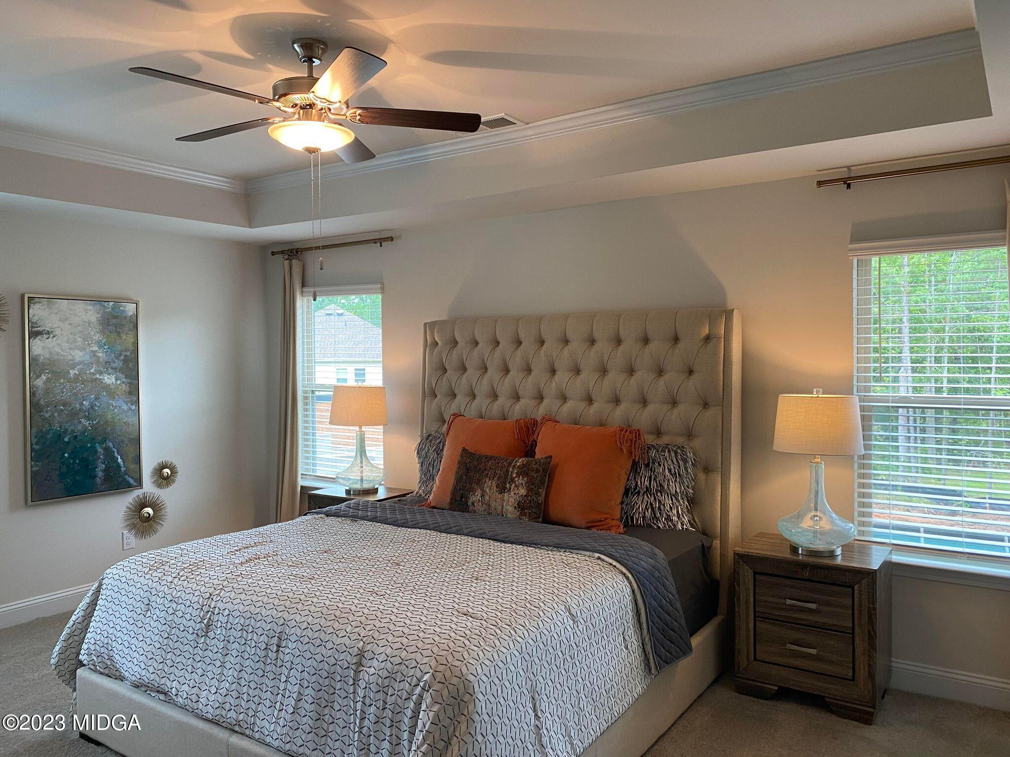 612 Britton Way, Unit 70 Macon, GA 31216 - Photo 2 of 18 a bedroom with a bed mirror and a window
