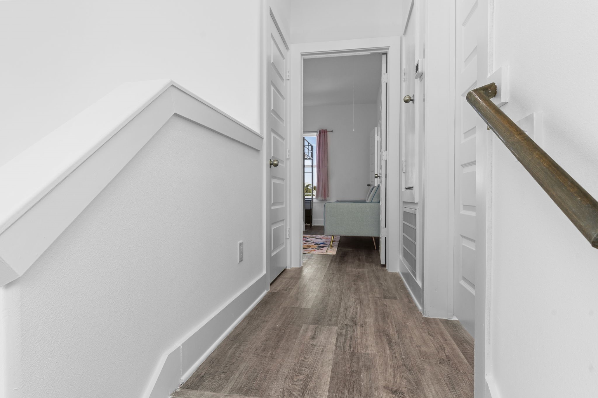 6721 St Augustine Street Houston, TX 77021 - Photo 20 of 45 Well-lit hallway offering easy access to bedrooms and baths.