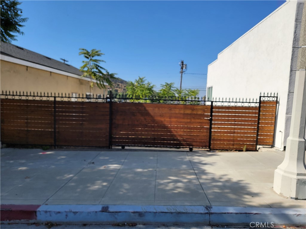 9939 Commerce Avenue Tujunga, CA 91042 - Photo 6 of 12 a view of a house with a yard