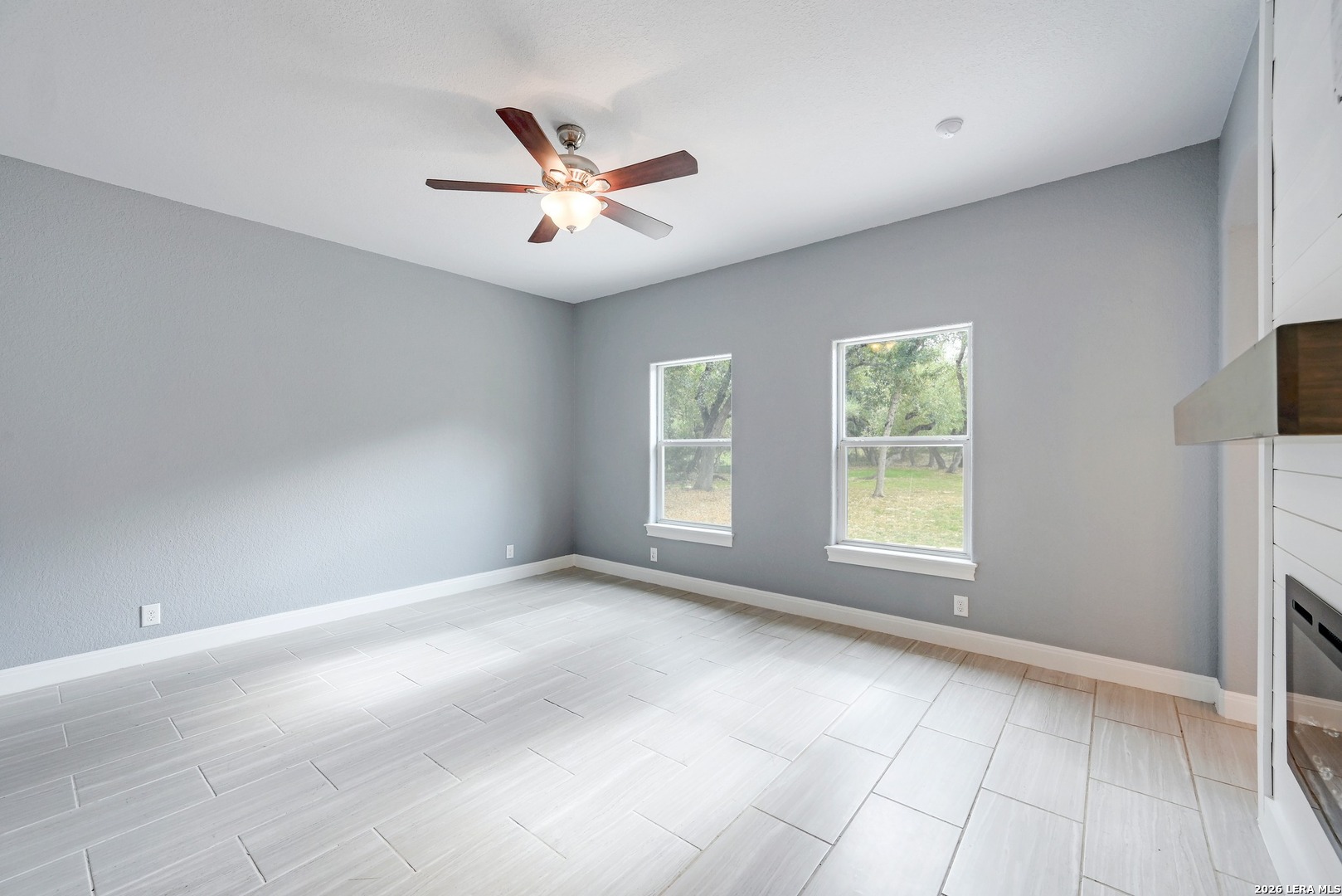 1134 Victoria Spring Branch, TX 78070 - Photo 11 of 28 an empty room with windows and fan