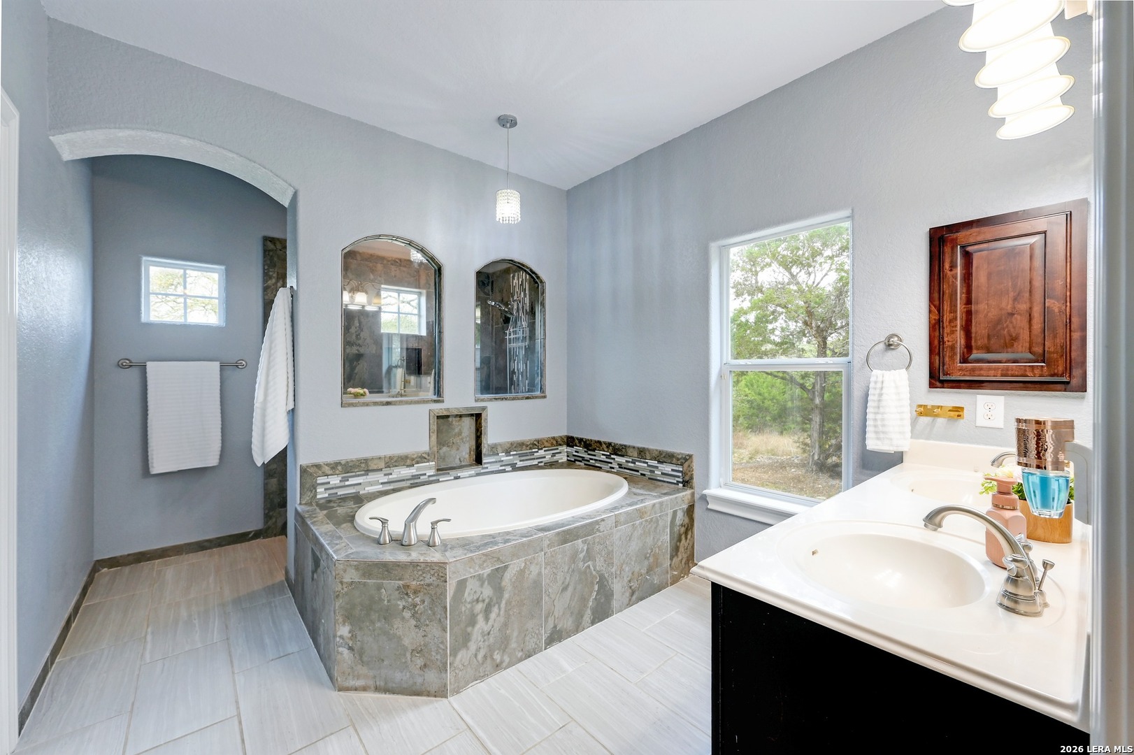1134 Victoria Spring Branch, TX 78070 - Photo 13 of 28 a spacious bathroom with a tub sink and mirror