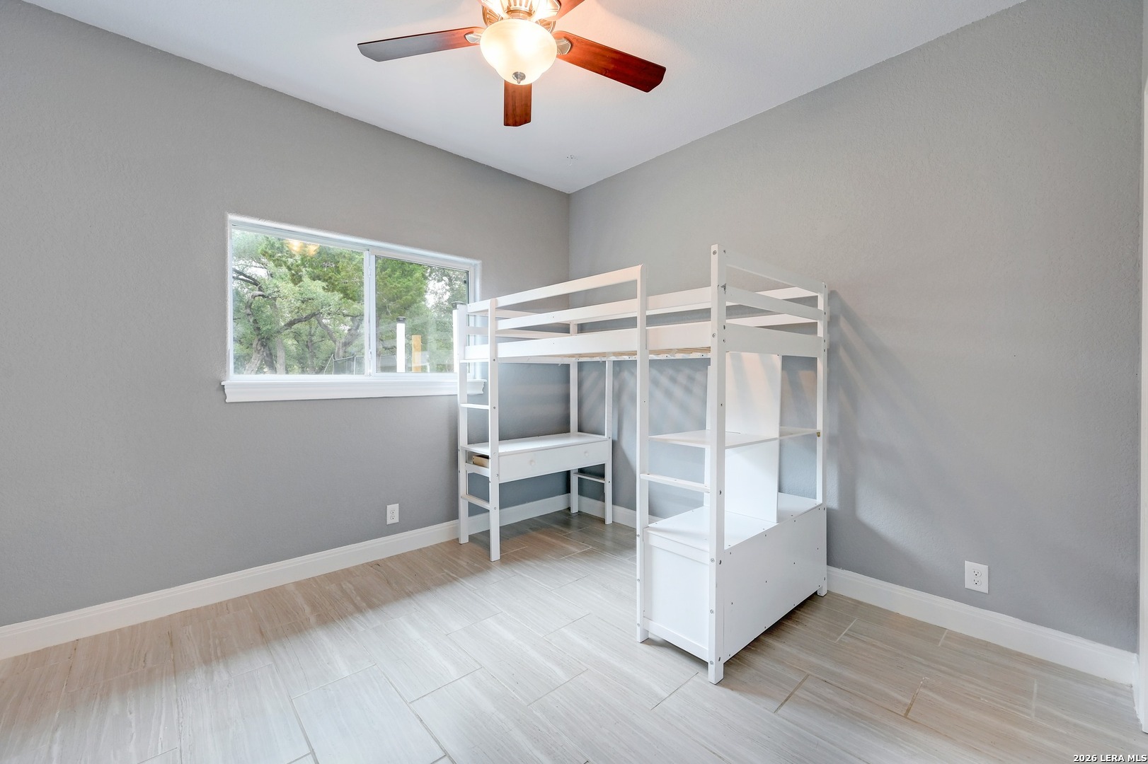 1134 Victoria Spring Branch, TX 78070 - Photo 16 of 28 wooden floor in an empty room with a window