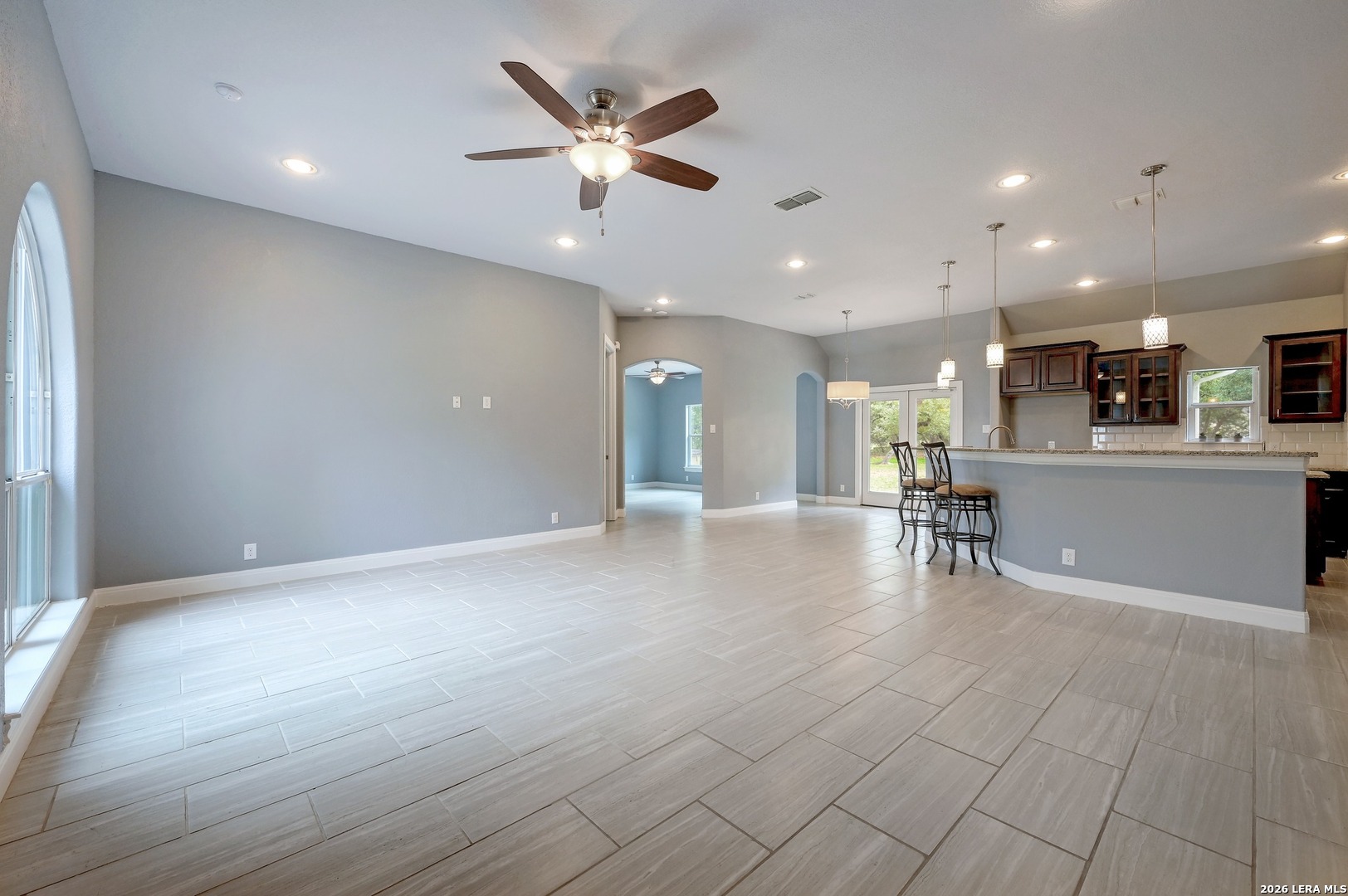 1134 Victoria Spring Branch, TX 78070 - Photo 5 of 28 an open area with kitchen view and a refrigerator