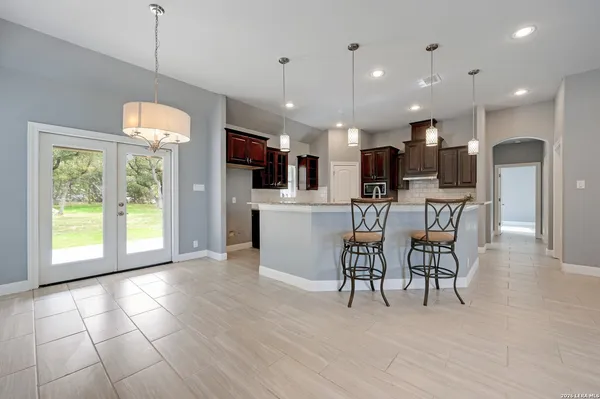 a view of a kitchen with furniture and a table