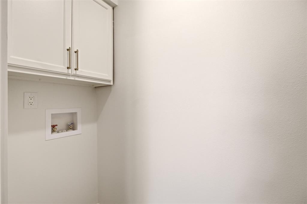 908 Isbell Road, Unit B Fort Worth, TX 76114 - Photo 12 of 27 White shaker-style cabinetry with brushed nickel hardware, laundry hookups, and a 240V outlet
