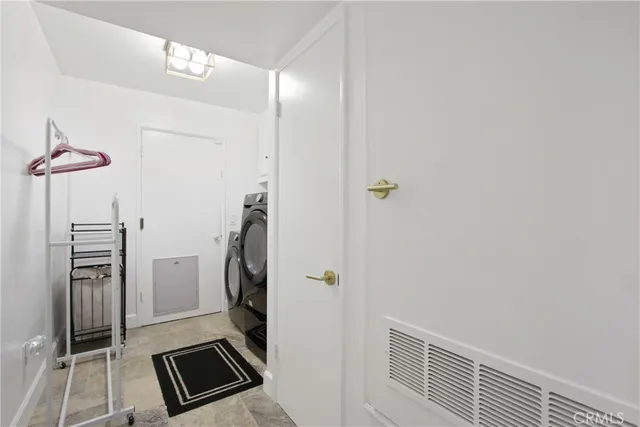 a view of a storage & utility room with a sink