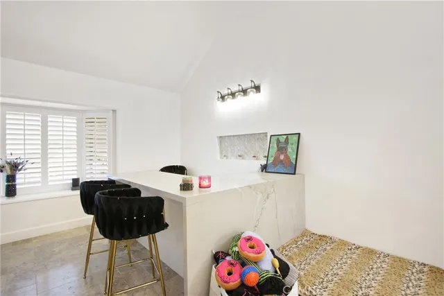 a bedroom with furniture and a window