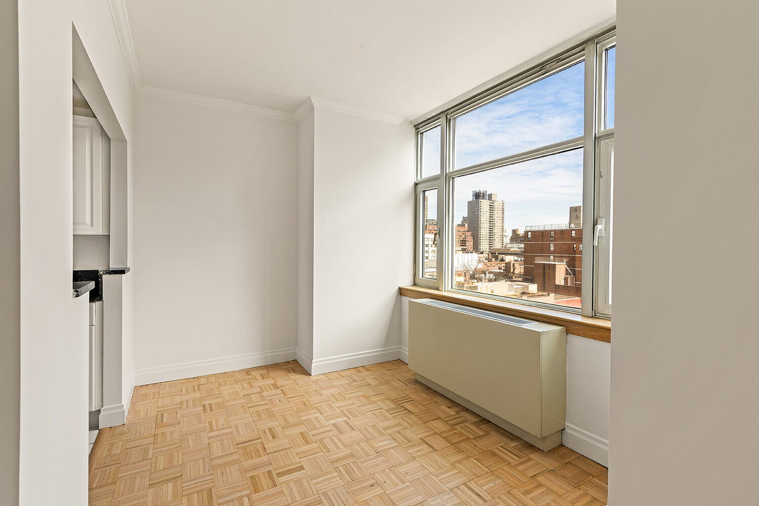 404 East 76th Street, Unit 10D Manhattan, NY 10021 - Photo 2 of 9 a view of a room with a large window