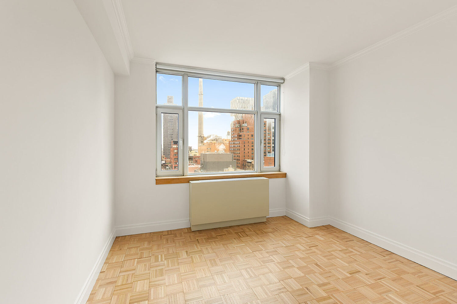 404 East 76th Street, Unit 10D Manhattan, NY 10021 - Photo 5 of 9 an empty room with a window