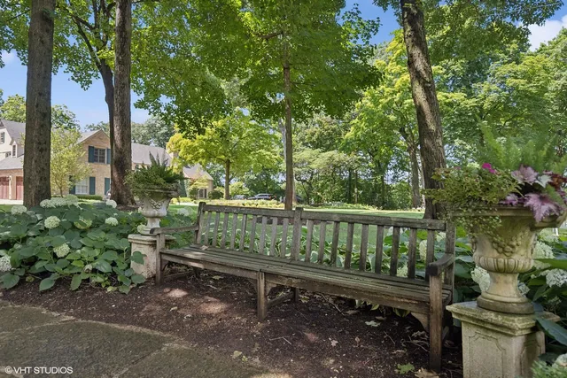 a living room with furniture a window and a fireplace