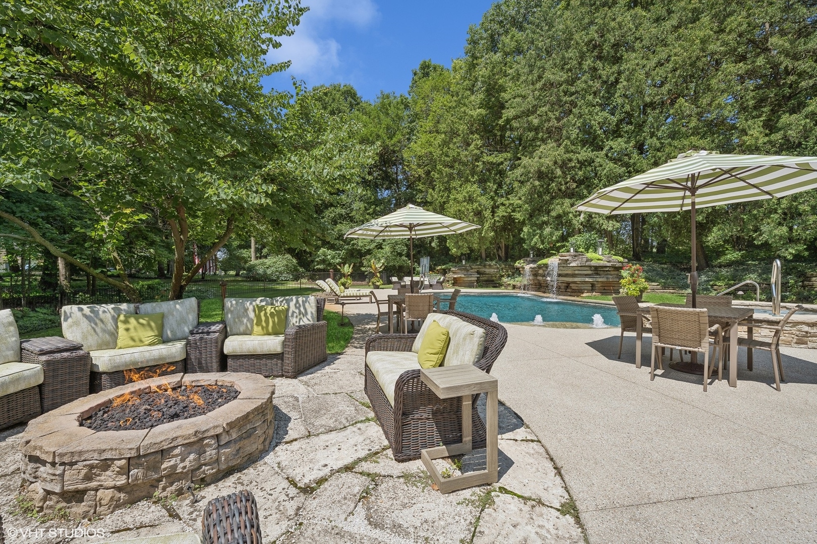 875 Country Club Road St. Charles, IL 60174 - Photo 16 of 96 a patio with patio a table and chairs under an umbrella