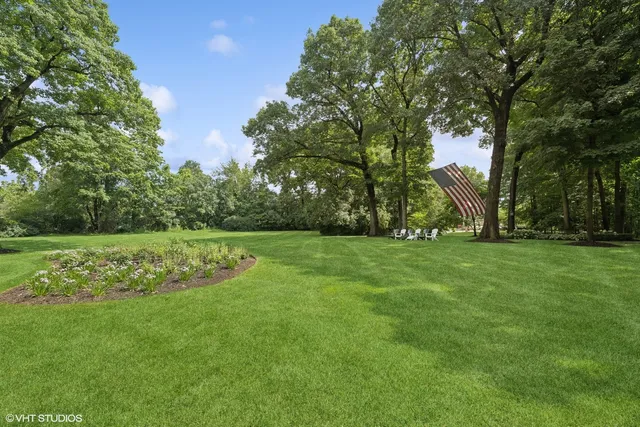 a view of a patio with couches table and chairs and potted plants