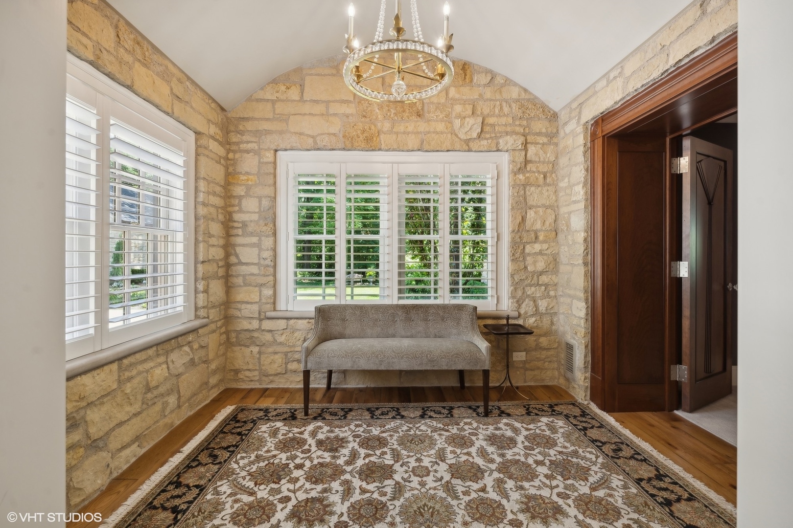 875 Country Club Road St. Charles, IL 60174 - Photo 51 of 96 a living room with a rug and a window