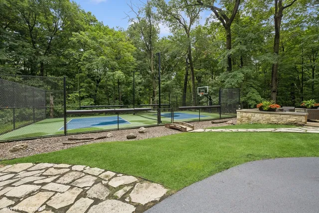 a view of a patio with couches chairs and a fire pit