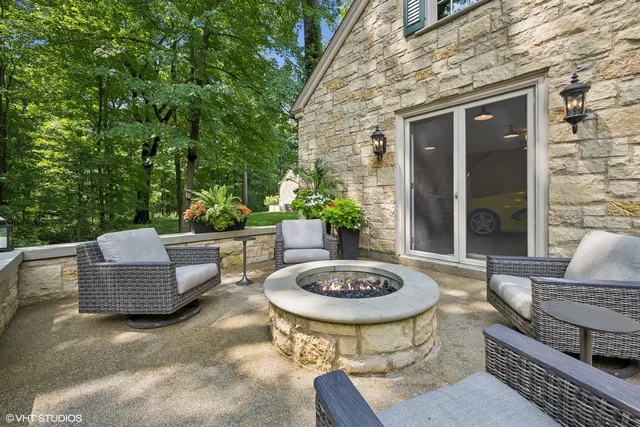a patio with patio a table and chairs under an umbrella