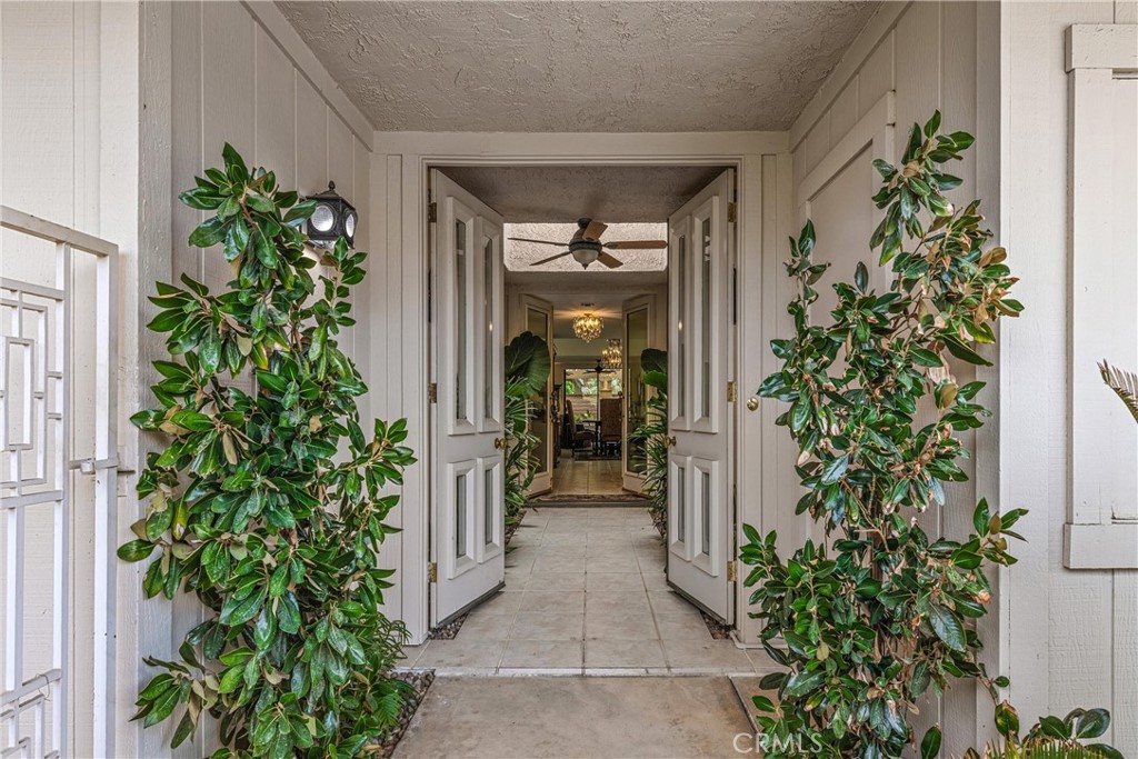 19 Cornell Drive Rancho Mirage, CA 92270 - Photo 2 of 22 an entrance to house with yard and hallway