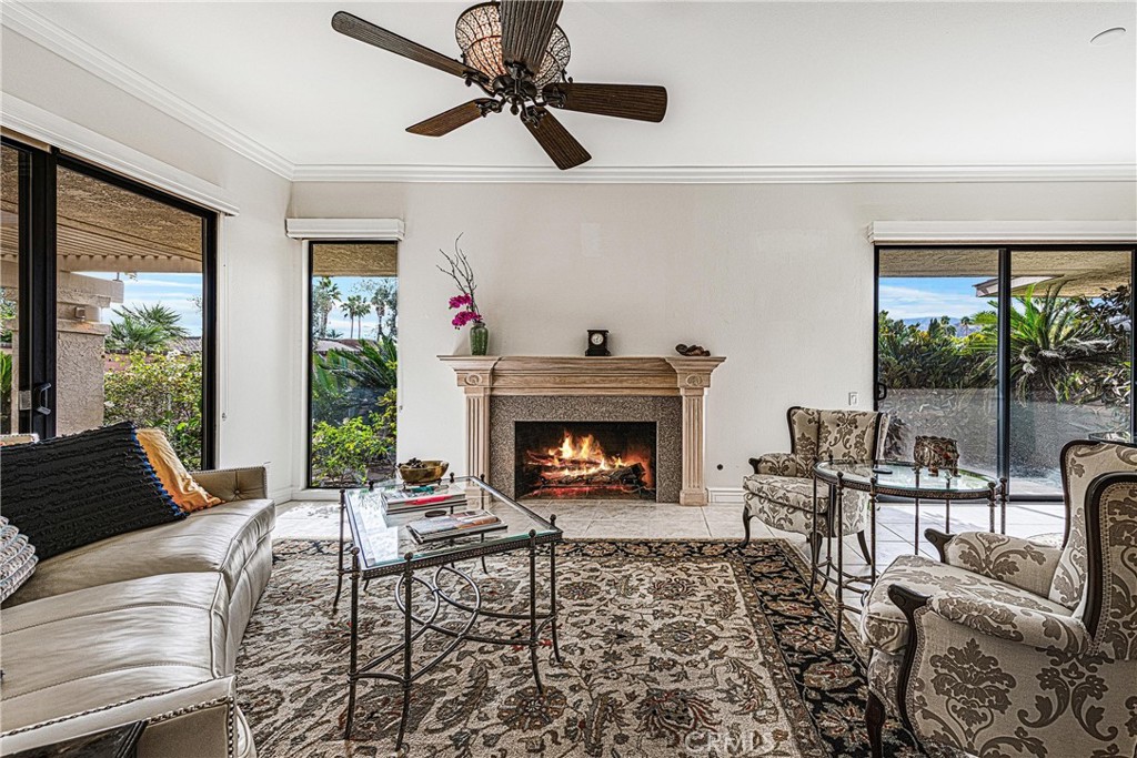 19 Cornell Drive Rancho Mirage, CA 92270 - Photo 6 of 22 a living room with furniture and a fireplace