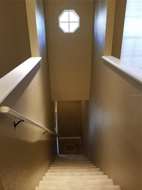 835 Grand Regency Pointe, Unit 205 Altamonte Springs, FL 32714 - Photo 13 of 18 an empty room with a mirror