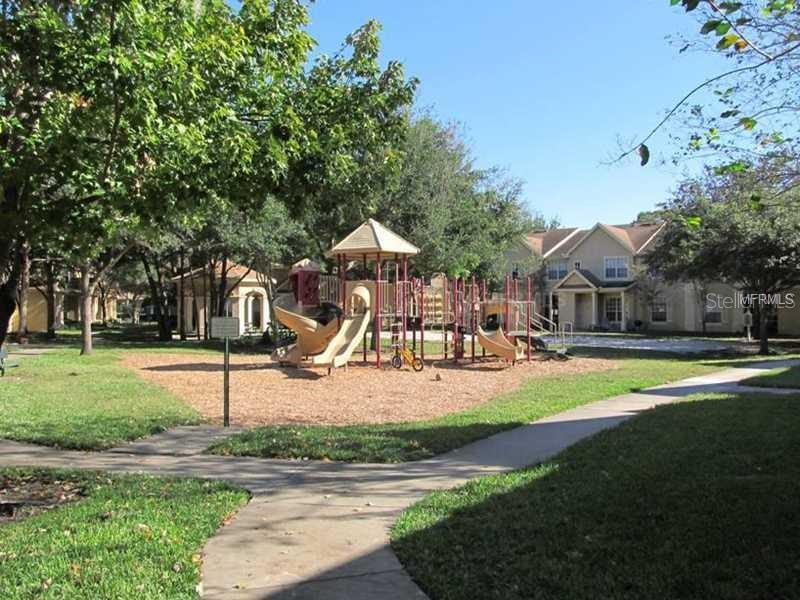 835 Grand Regency Pointe, Unit 205 Altamonte Springs, FL 32714 - Photo 16 of 18 a view of a house with swimming pool and sitting area