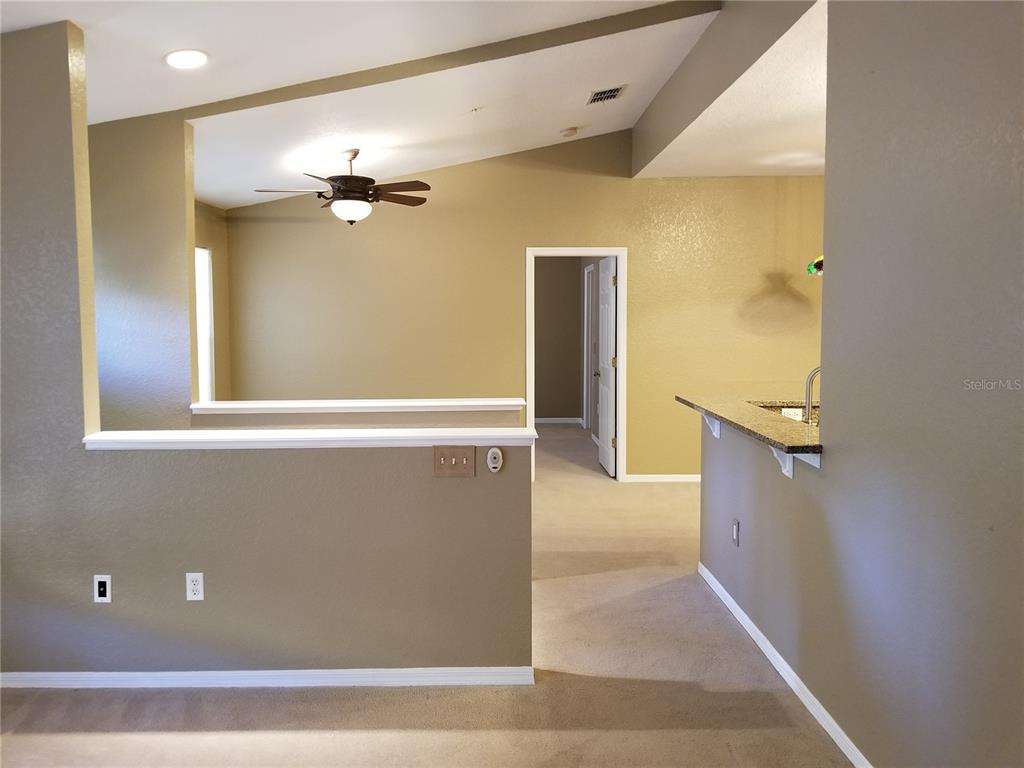 835 Grand Regency Pointe, Unit 205 Altamonte Springs, FL 32714 - Photo 3 of 18 a view of a living room with a wooden floor
