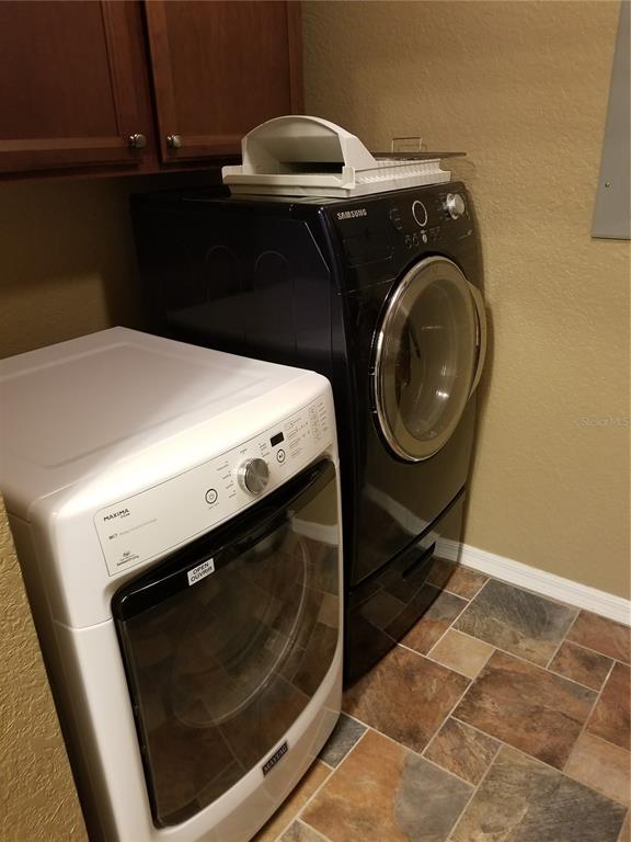 835 Grand Regency Pointe, Unit 205 Altamonte Springs, FL 32714 - Photo 8 of 18 a utility room with dryer and washer