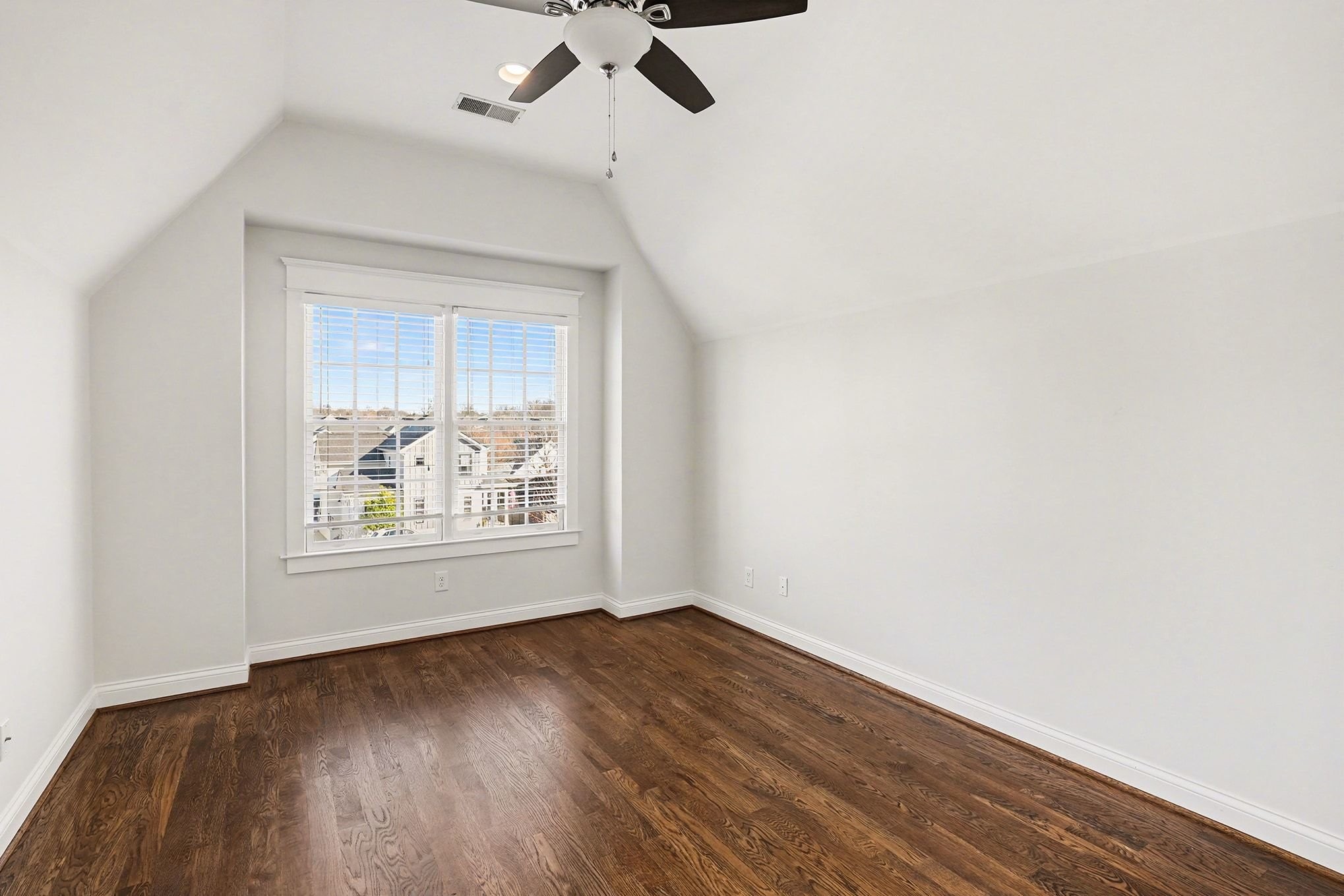 1815 A Shackleford Road Nashville, TN 37215 - Photo 22 of 39 an empty room with wooden floor chandelier fan and windows
