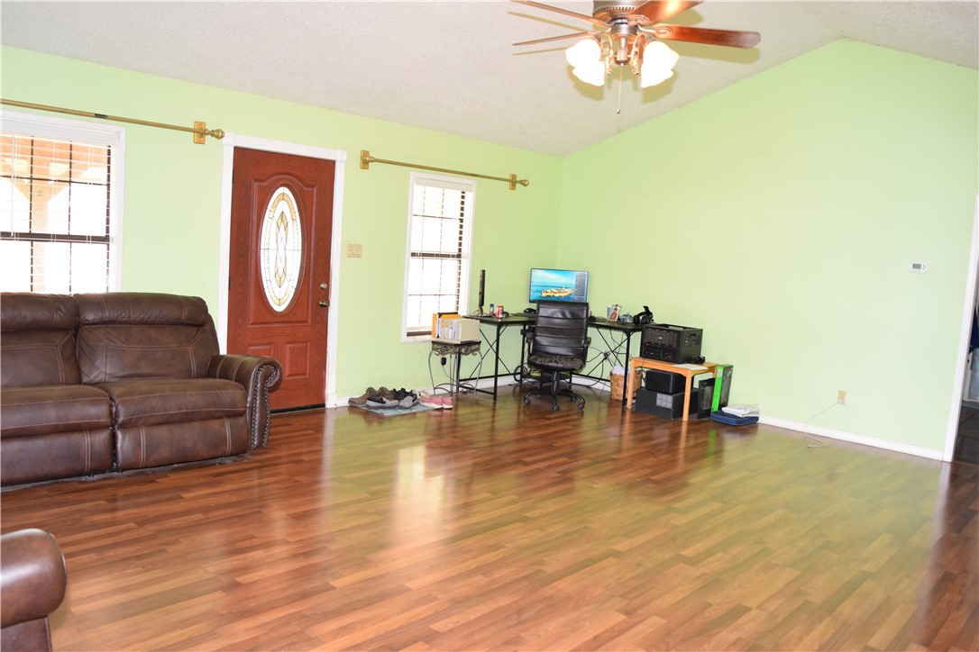 24772 County Road 360 Mathis, TX 78368 - Photo 4 of 30 a living room with fireplace furniture and a large window