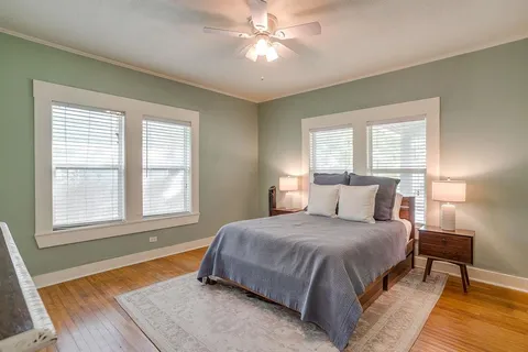 a bedroom with a bed and window