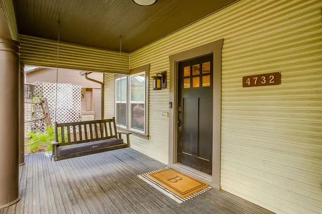 a view of a door and wooden floor