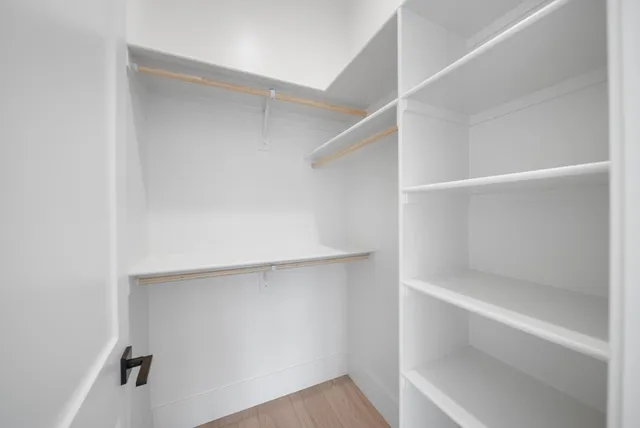 a view of an empty walk in closet
