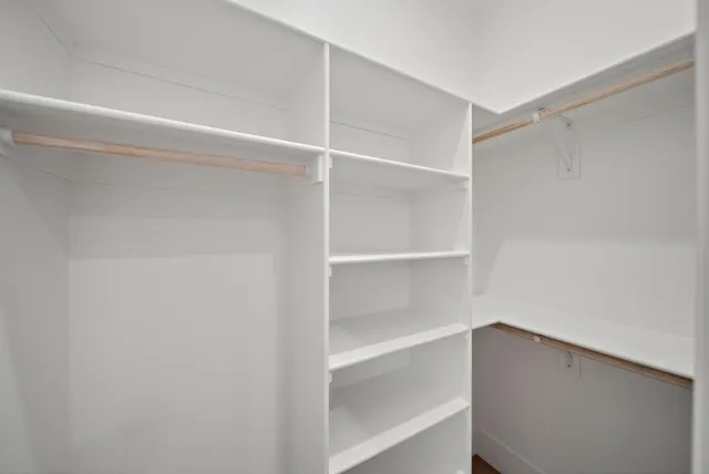a view of an empty walk in closet