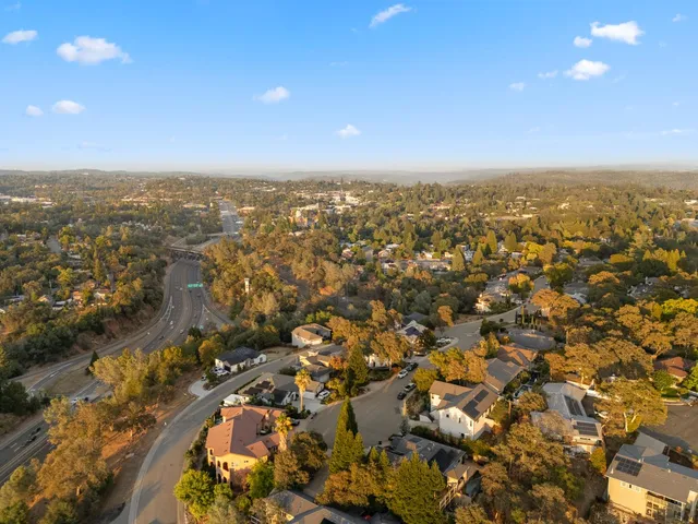 an aerial view of residential building with parking space