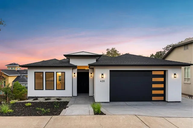 a front view of a house with yard