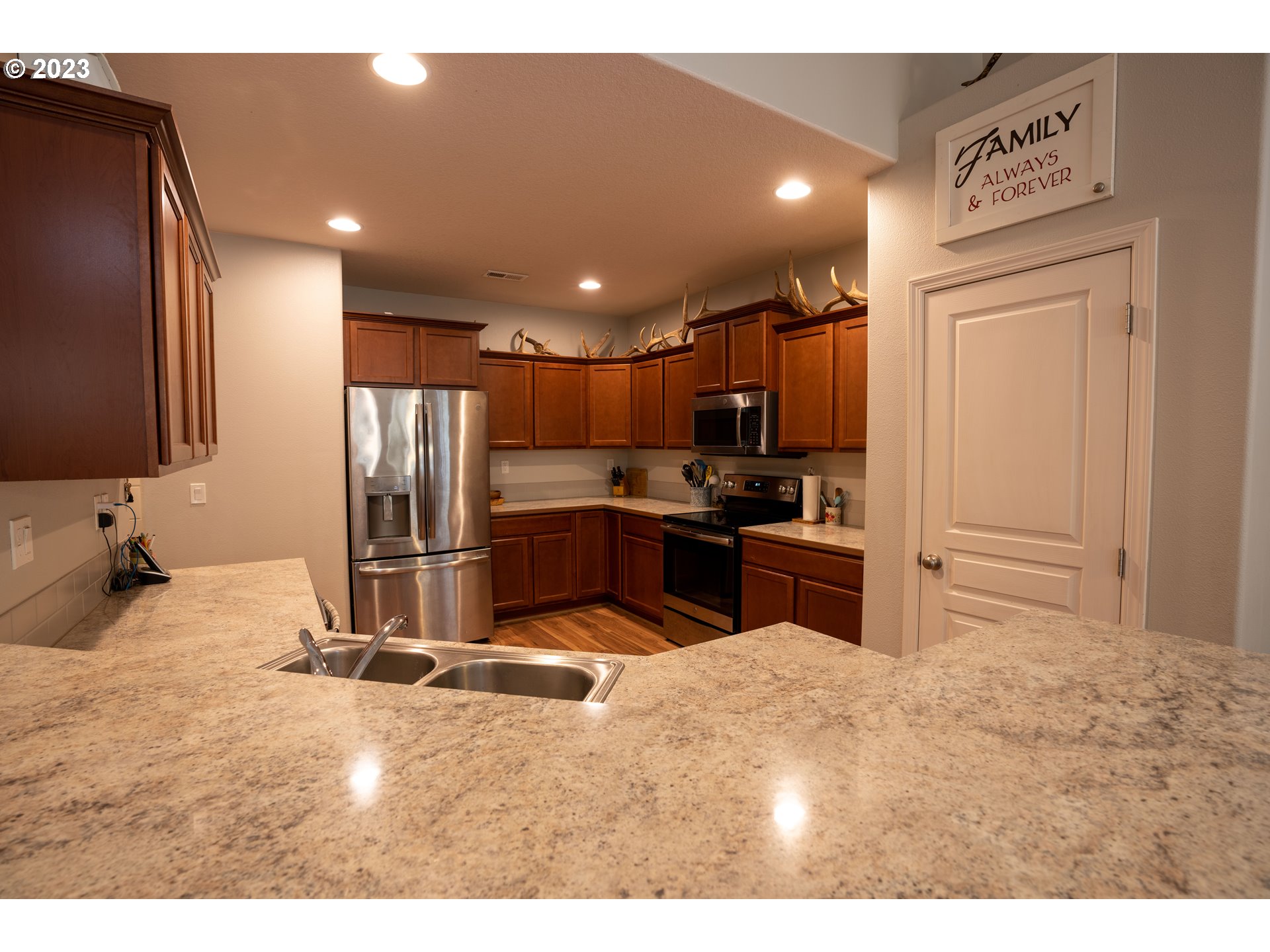 37489 South Wilhoit Road Molalla, OR 97038 - Photo 14 of 38 a kitchen with a refrigerator sink and cabinets