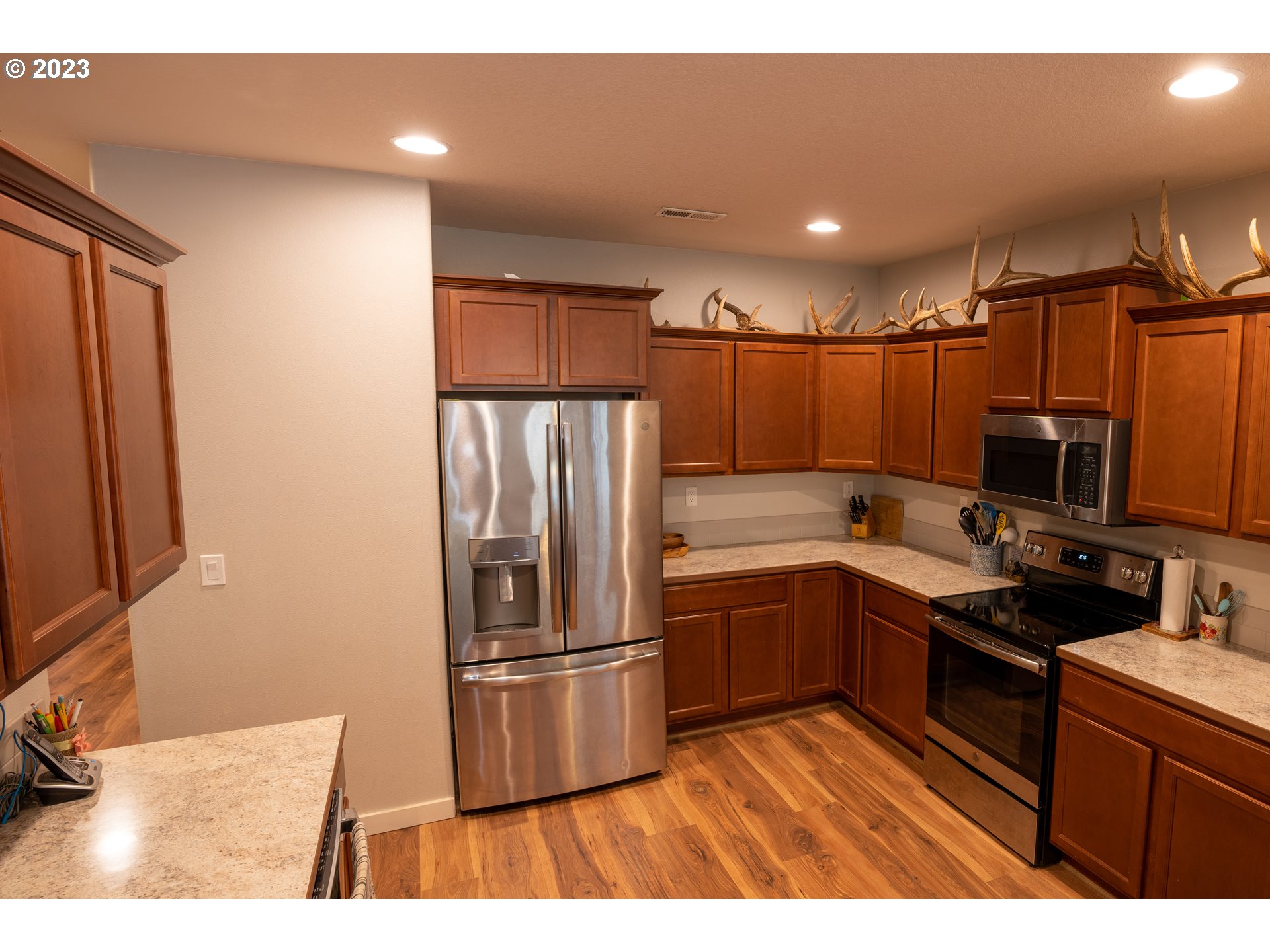 37489 South Wilhoit Road Molalla, OR 97038 - Photo 15 of 38 a kitchen with kitchen island a counter top space cabinets and stainless steel appliances