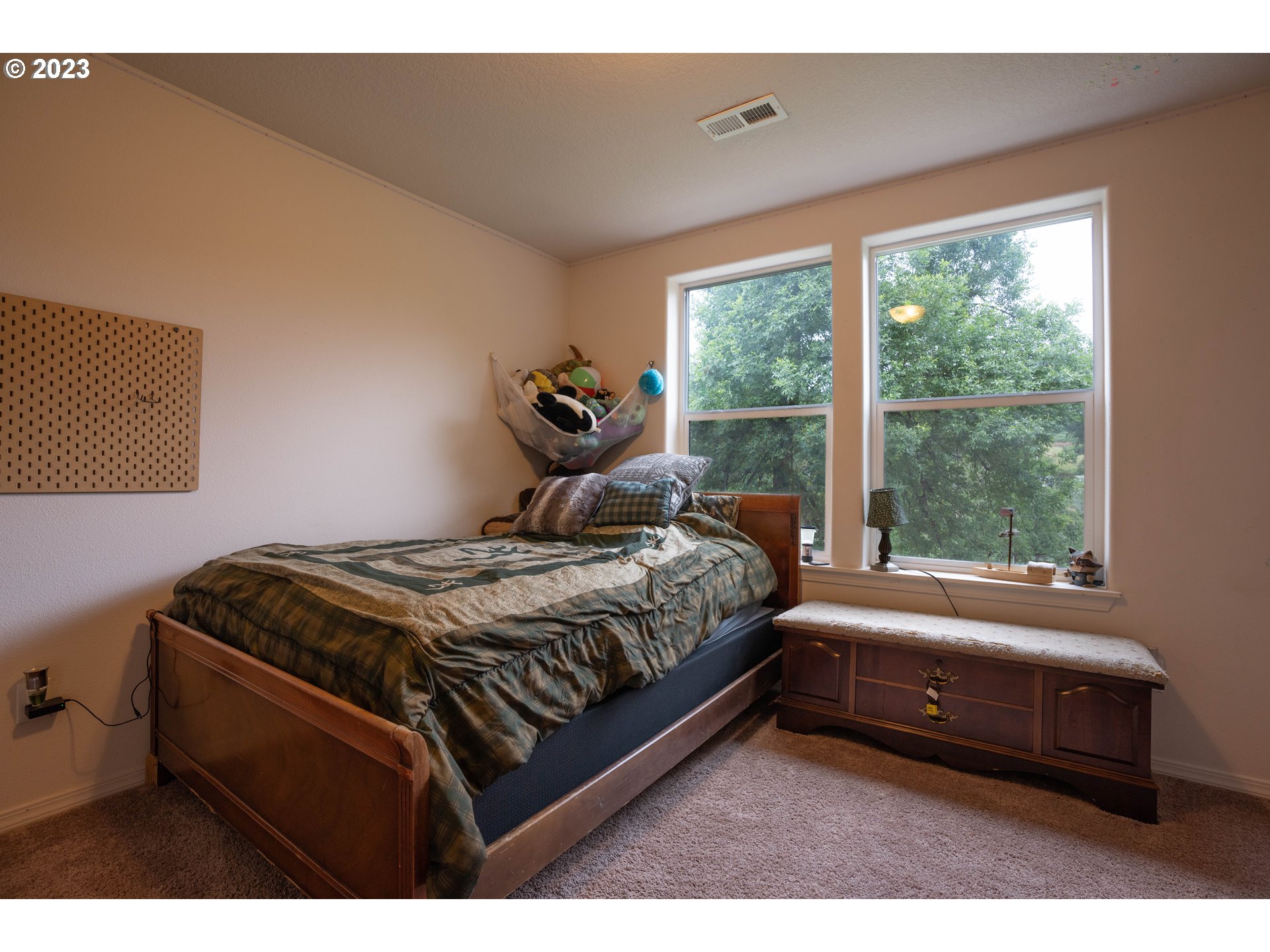 37489 South Wilhoit Road Molalla, OR 97038 - Photo 17 of 38 a bedroom with a bed and a window