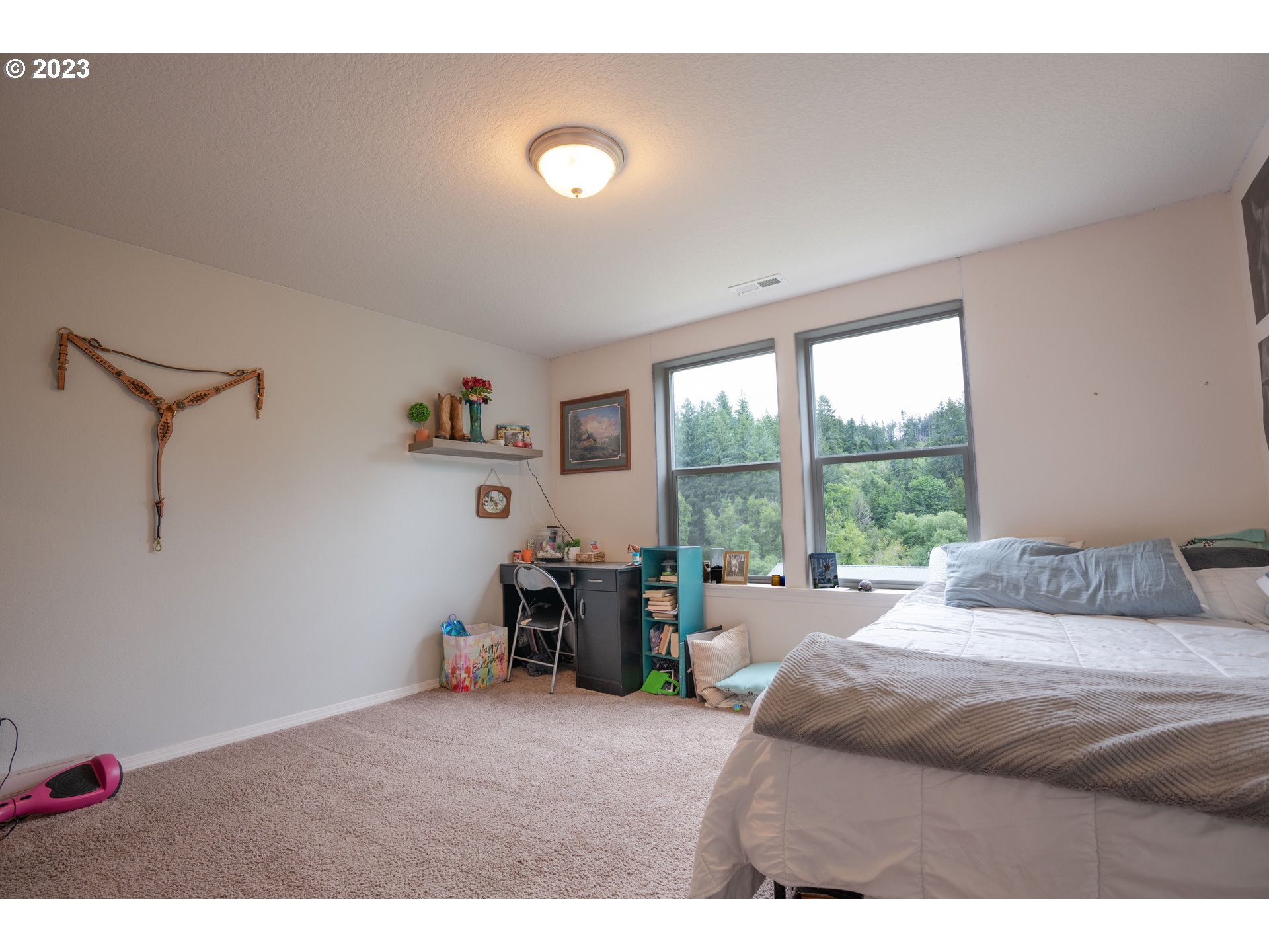 37489 South Wilhoit Road Molalla, OR 97038 - Photo 21 of 38 a bedroom with a bed and a large window