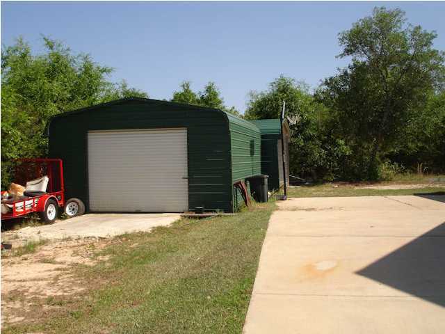 5127 Keyser Mill Road Baker, FL 32531 - Photo 13 of 13 a view of car parked in front of house