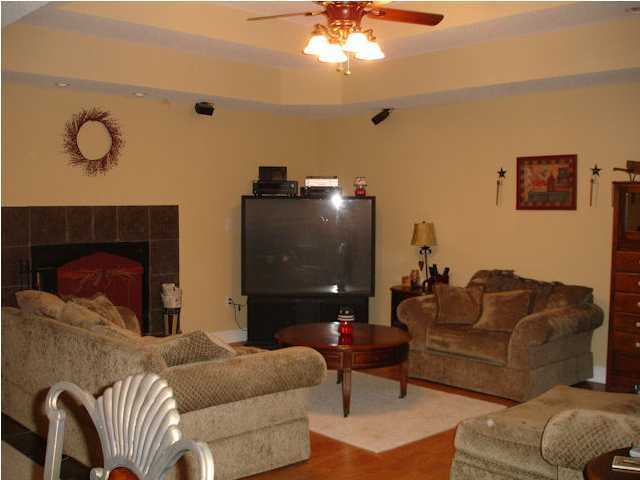 5127 Keyser Mill Road Baker, FL 32531 - Photo 5 of 13 a living room with furniture and a fireplace