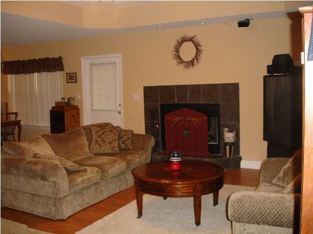 5127 Keyser Mill Road Baker, FL 32531 - Photo 6 of 13 a living room with furniture and a fireplace