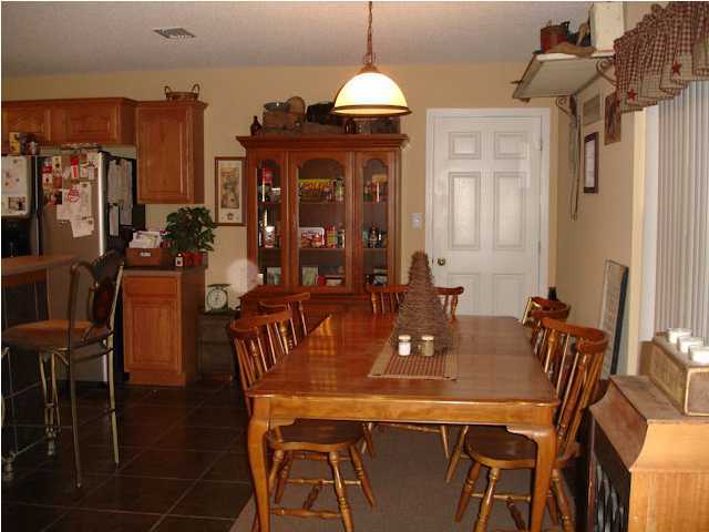 5127 Keyser Mill Road Baker, FL 32531 - Photo 10 of 13 a dining room with furniture and window