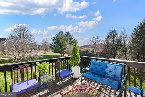 a view of a two chairs in the deck