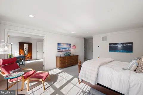 a bedroom with a bed and furniture