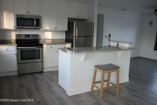 a bathroom with a tub sink and a shower