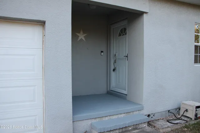 a kitchen with stainless steel appliances a refrigerator sink and wooden floor