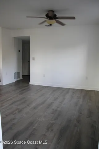 a kitchen with granite countertop a sink and a stove